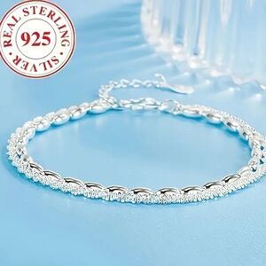 Elegant 925 sterling silver charm bracelet.
